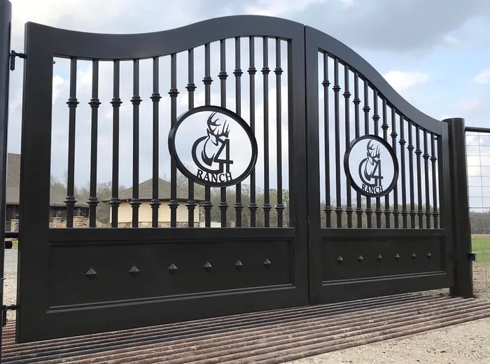The Cali Gate from close in and slightly to one side, the collars on each baluster lining up into two bands and the diamond studs running along the lower panel.