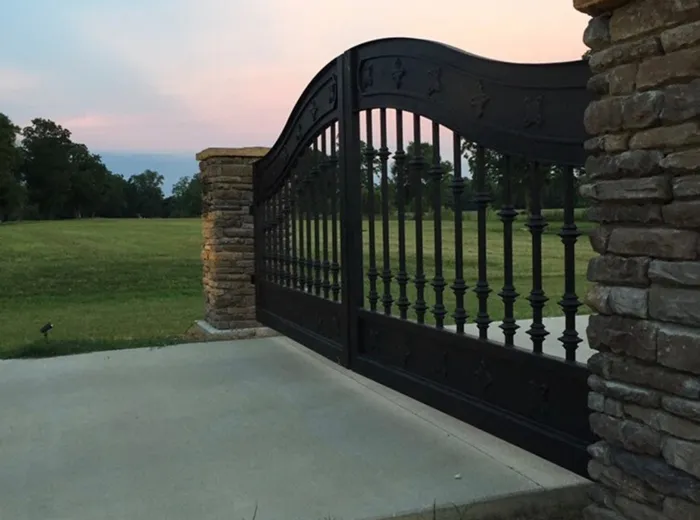The Ham Gate seen from the side of the drive, stone column in the foreground and lawn beyond.